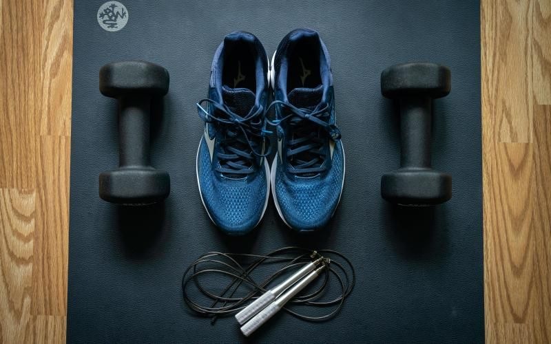 a pair of shoes and a pair of free weights